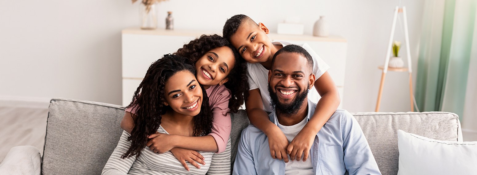 Smiling family outside
