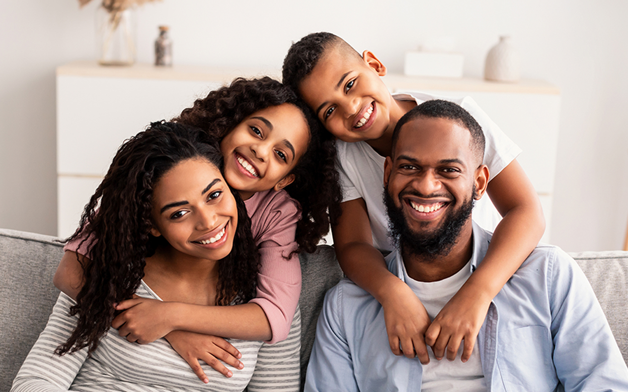 Smiling family outside